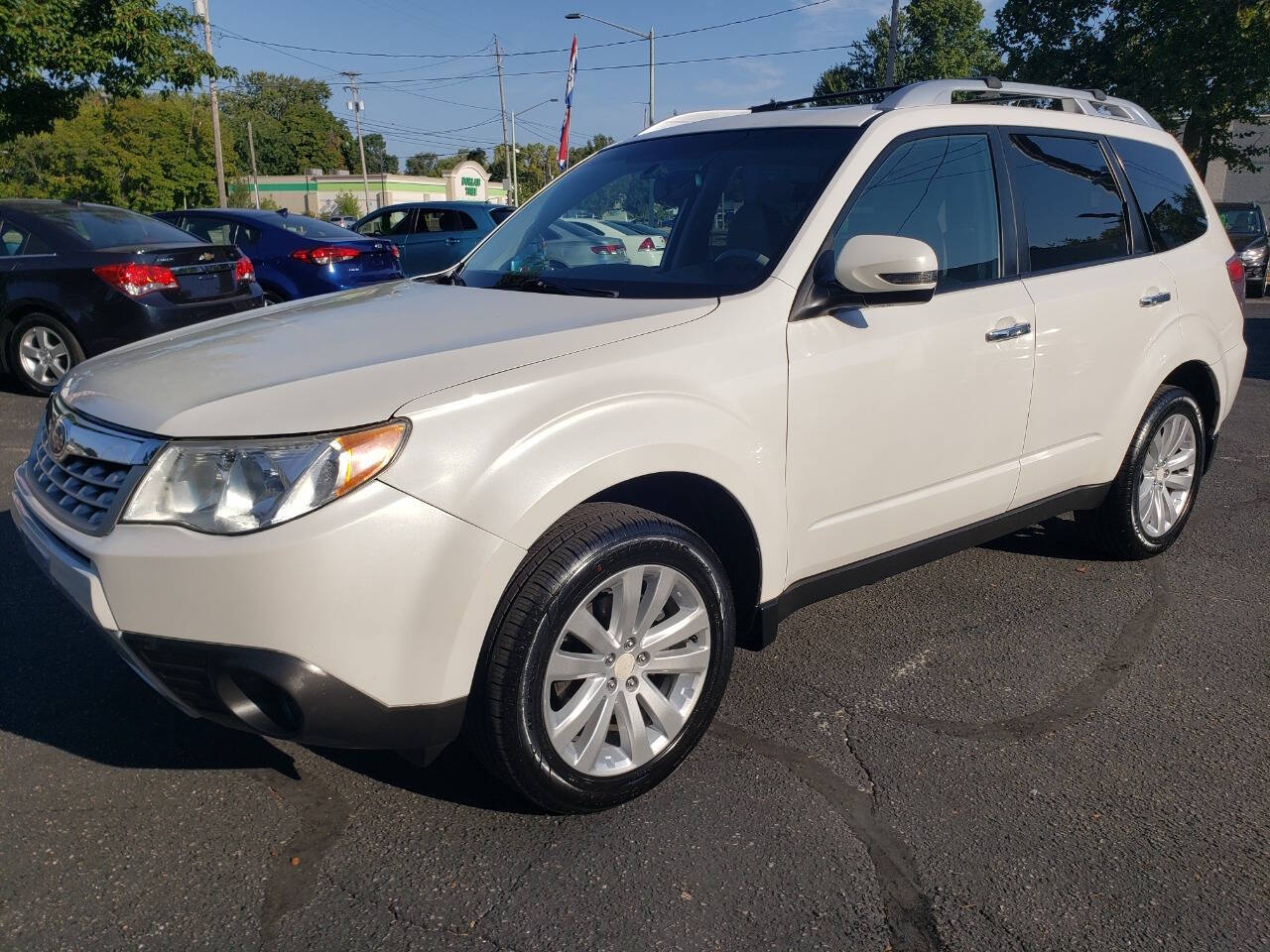 2011 Subaru Forester for sale at Auto Shop in Wyoming, MI