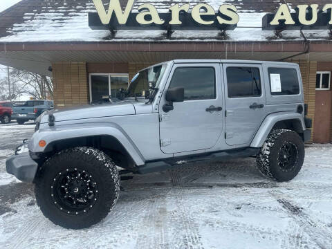 2013 Jeep Wrangler Unlimited for sale at Wares Auto Sales INC in Traverse City MI