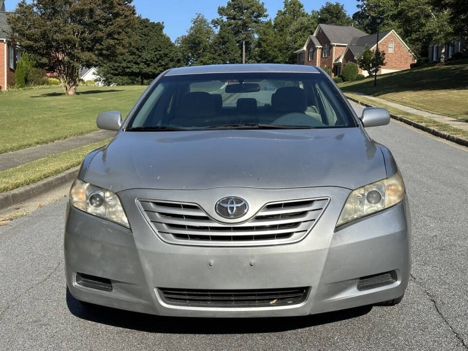 2009 Toyota Camry for sale at SHURE AUTO SALES in Snellville, GA