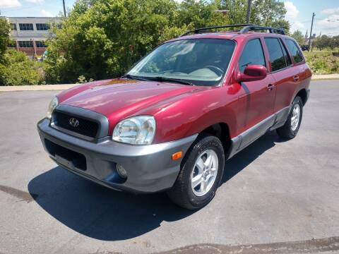 2004 Hyundai Santa Fe for sale at GLASS CITY AUTO CENTER in Lancaster OH