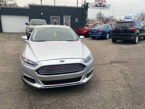 2016 Ford Fusion for sale at Castle Cars Inc. in Lansing MI