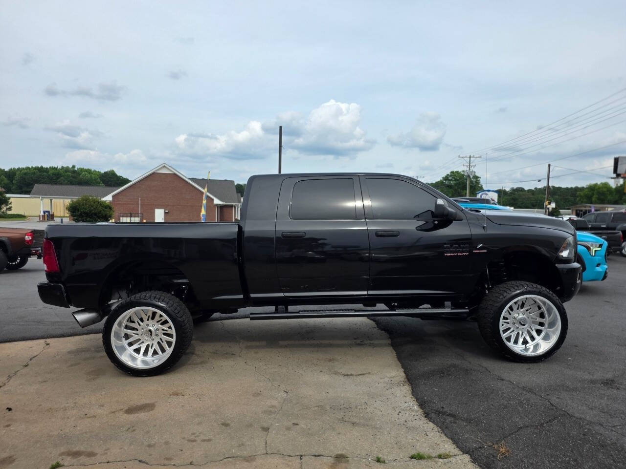 Black 2016 Ram 2500 SLT 4x4 SLT 4dr Mega Cab 6.3 ft. SB Pickup 1