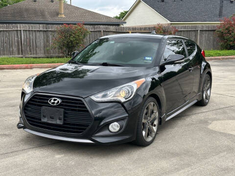 2015 Hyundai Veloster for sale at KM Motors LLC in Houston TX