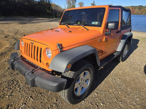 2012 Jeep Wrangler for sale at Rombaugh's Auto Sales in Battle Creek MI