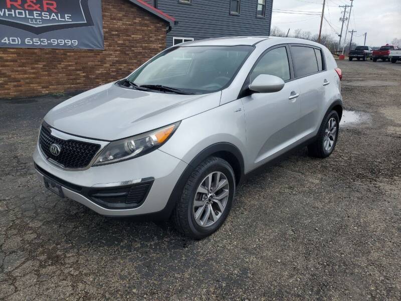 2015 Kia Sportage for sale at Rick's R & R Wholesale, LLC in Lancaster OH