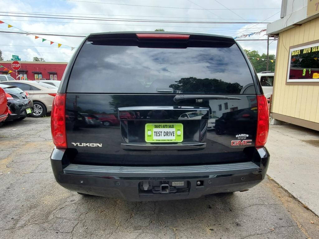 2008 GMC Yukon for sale at DAGO'S AUTO SALES LLC in Dalton, GA