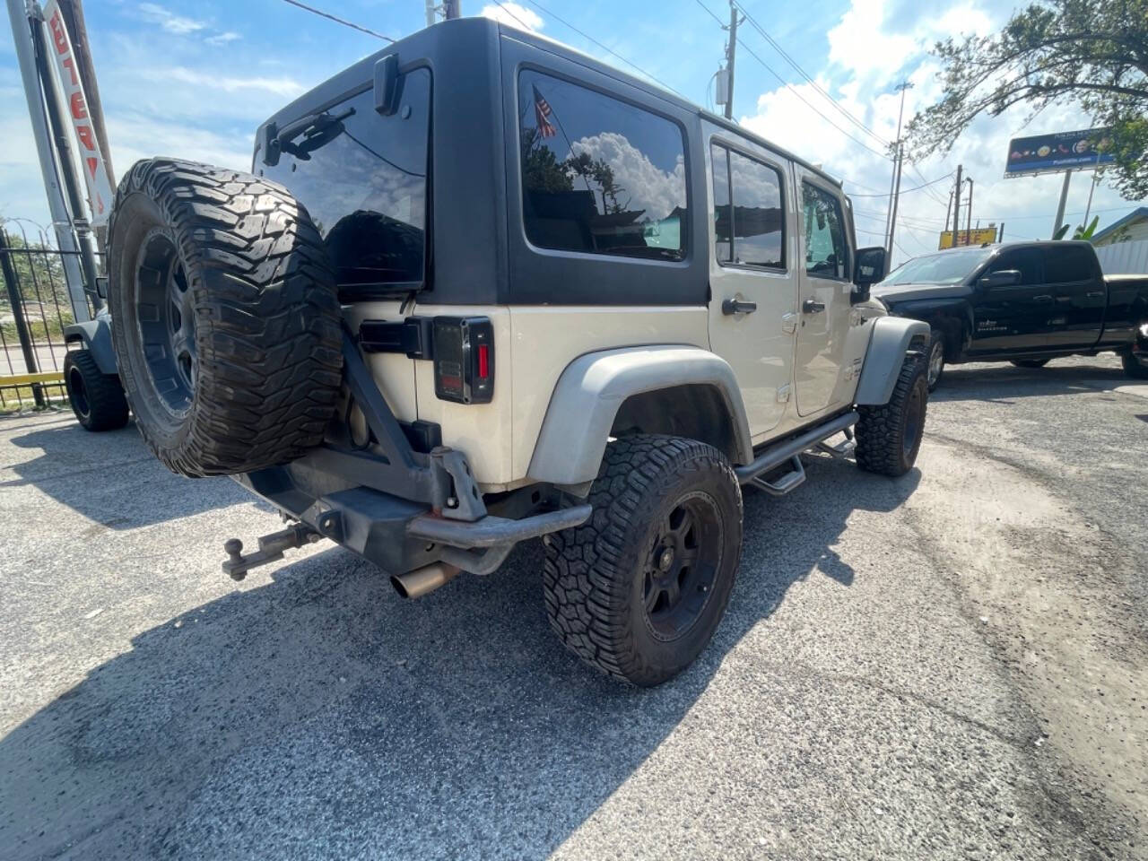 2011 Jeep Wrangler Unlimited for sale at DIAMOND MOTORS INC in Houston, TX