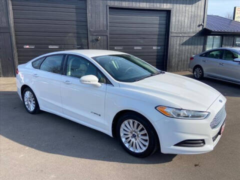 2013 Ford Fusion Hybrid for sale at HUFF AUTO GROUP in Jackson MI