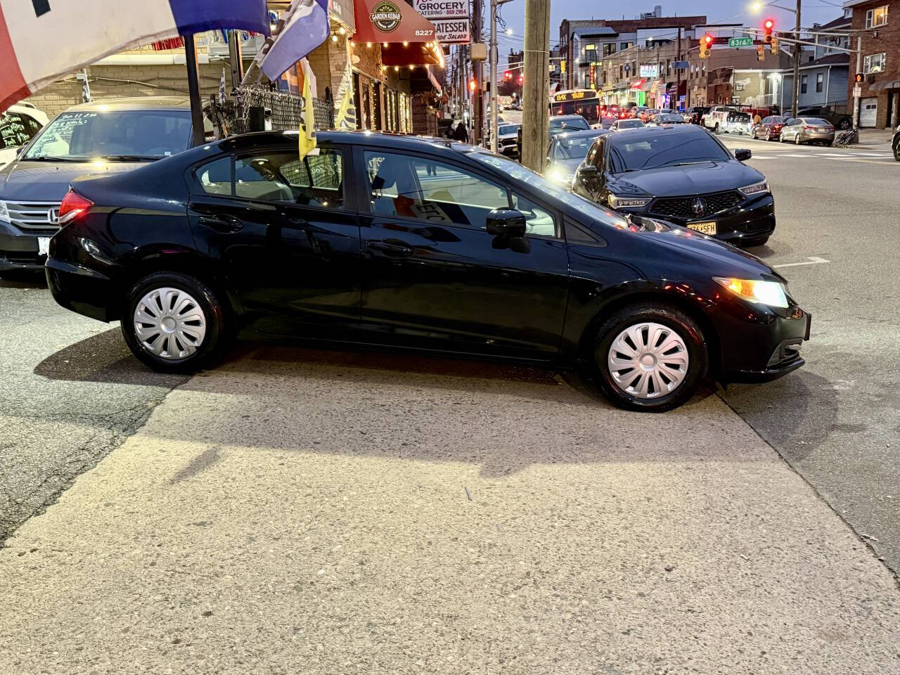 2014 Honda Civic LX 4dr Sedan CVT - Black exterior view 4