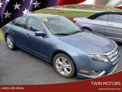 2012 Ford Fusion for sale at TWIN MOTORS in Madison OH