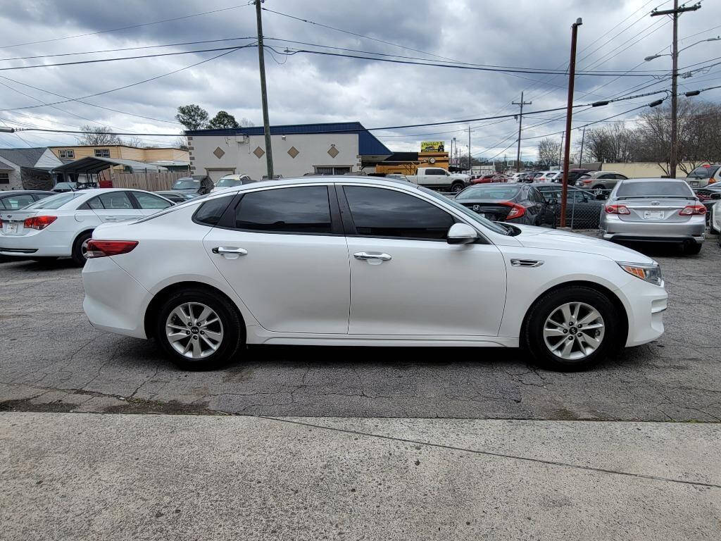 2016 Kia Optima for sale at DAGO'S AUTO SALES LLC in Dalton, GA