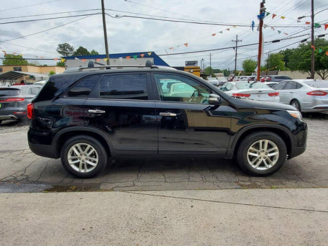 2014 Kia Sorento for sale at DAGO'S AUTO SALES LLC in Dalton, GA