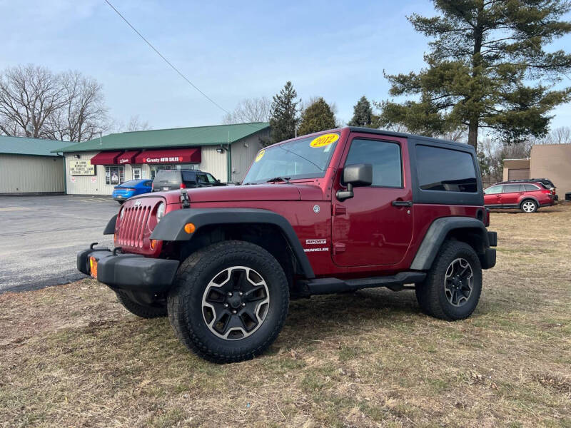 2012 Jeep Wrangler for sale at GRESTY AUTO SALES in Loves Park IL