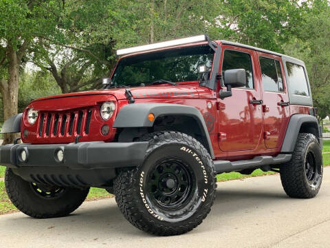 2013 Jeep Wrangler Unlimited for sale at HIGH PERFORMANCE MOTORS in Hollywood FL