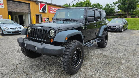 2013 Jeep Wrangler Unlimited for sale at SOUTH COUNTY AUTO CENTER in Weldon Spring MO