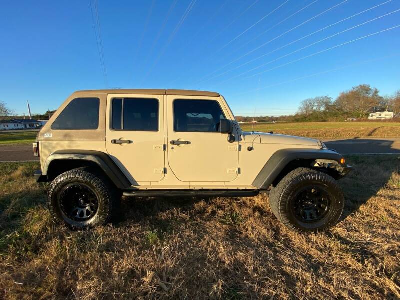 2011 Jeep Wrangler Unlimited for sale at Tennessee Valley Wholesale Autos LLC in Huntsville AL