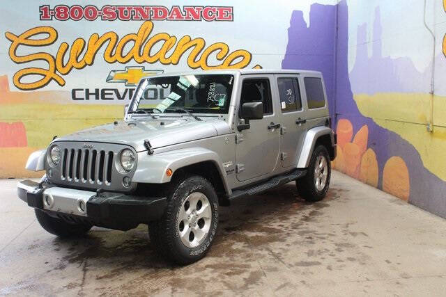 Used 2015 Jeep Wrangler Unlimited Sahara with VIN 1C4BJWEG2FL758881 for sale in Grand Ledge, MI