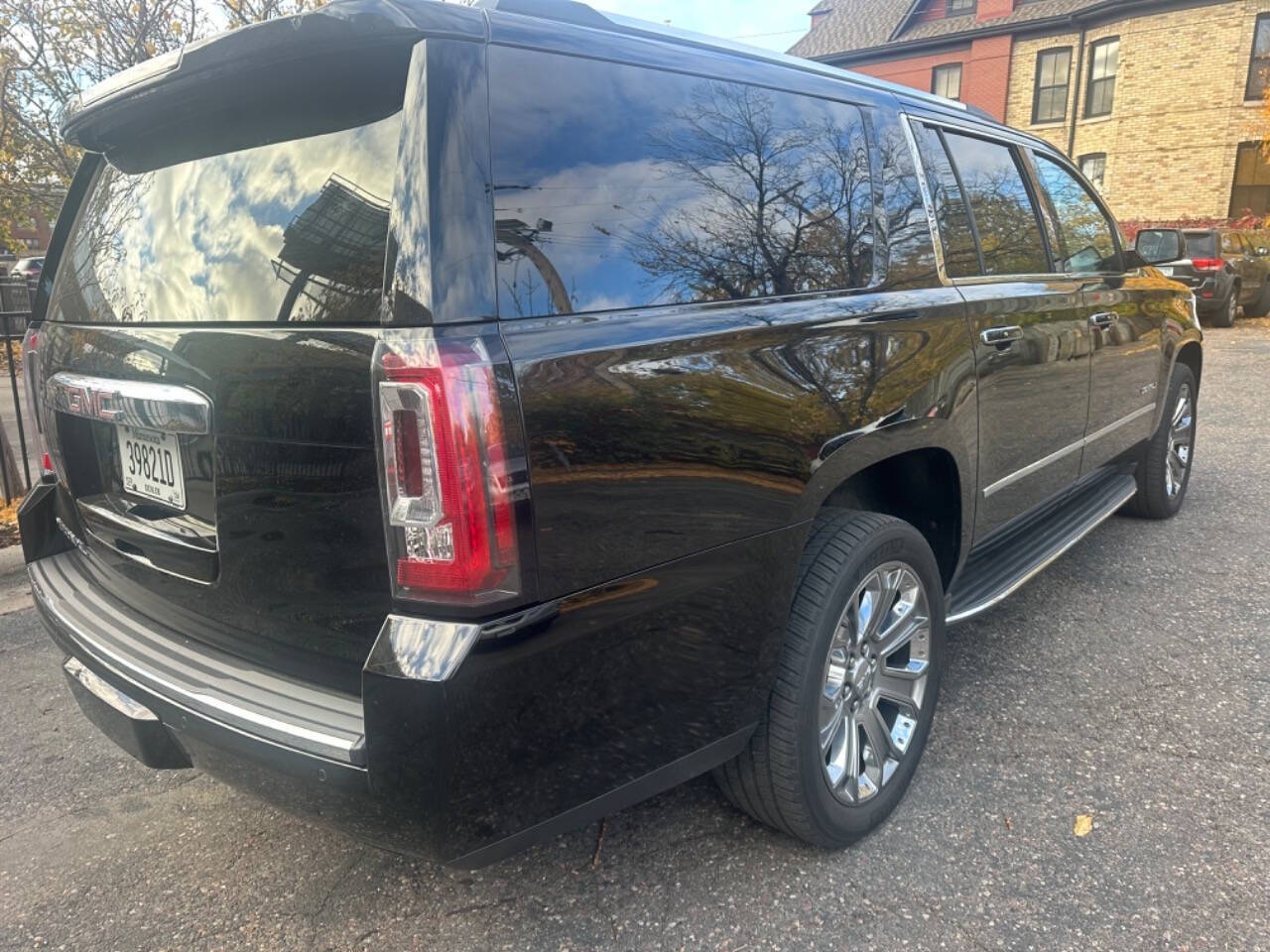 2015 GMC Yukon XL for sale at JUST AUTOS in MINNEAPOLIS, MN