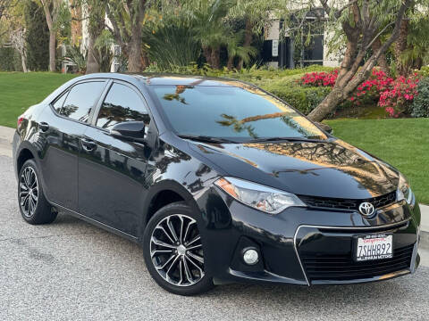 2016 Toyota Corolla for sale at MILLENNIUM MOTORS in Van Nuys CA