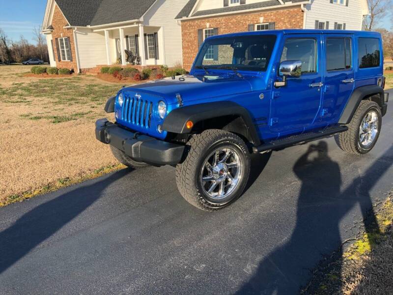 2015 Jeep Wrangler Unlimited for sale at Performance Auto Center Inc in Benson NC