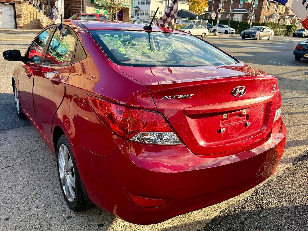 2012 Hyundai Accent GLS 4dr Sedan - Red exterior view 4