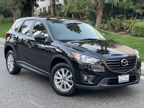 2016 Mazda CX-5 for sale at MILLENNIUM MOTORS in Van Nuys CA