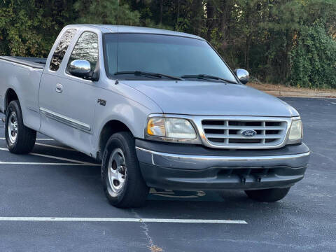 1999 Ford F-150 for sale at Two Brothers Auto Sales in Loganville GA