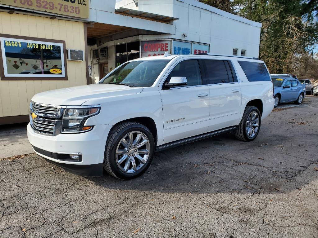 2015 Chevrolet Suburban for sale at DAGO'S AUTO SALES LLC in Dalton, GA