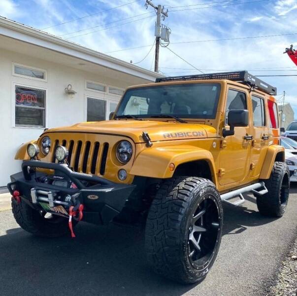 2014 Jeep Wrangler Unlimited for sale at PONO'S USED CARS in Hilo HI