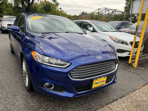 2014 Ford Fusion Hybrid for sale at Din Motors in Passaic NJ