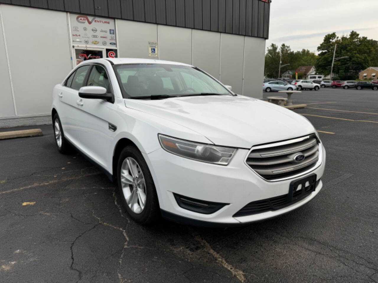 2014 Ford Taurus for sale at Carventure in Lansing, MI