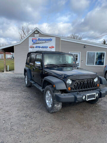 2013 Jeep Wrangler Unlimited for sale at ROUTE 11 MOTOR SPORTS in Central Square NY