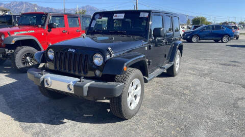 2014 Jeep Wrangler Unlimited for sale at INVICTUS MOTOR COMPANY in West Valley City UT