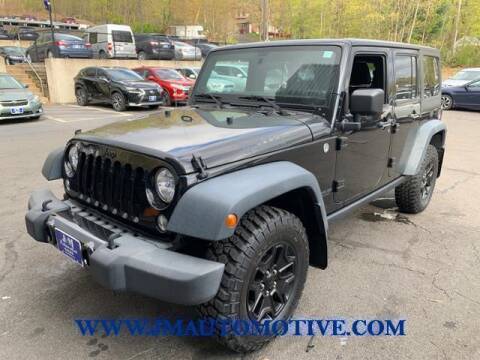 2014 Jeep Wrangler Unlimited for sale at J & M Automotive in Naugatuck CT