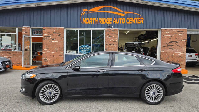 2014 Ford Fusion for sale at North Ridge Auto Center LLC in Madison, OH