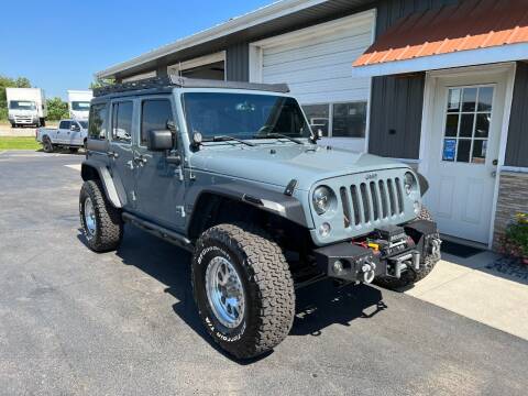 2014 Jeep Wrangler Unlimited for sale at PARKWAY AUTO in Hudsonville MI