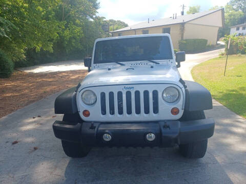 2012 Jeep Wrangler Unlimited for sale at Star Car in Woodstock GA