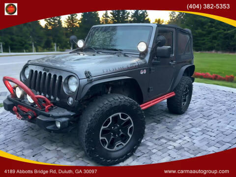 2014 Jeep Wrangler for sale at Carma Auto Group in Duluth GA