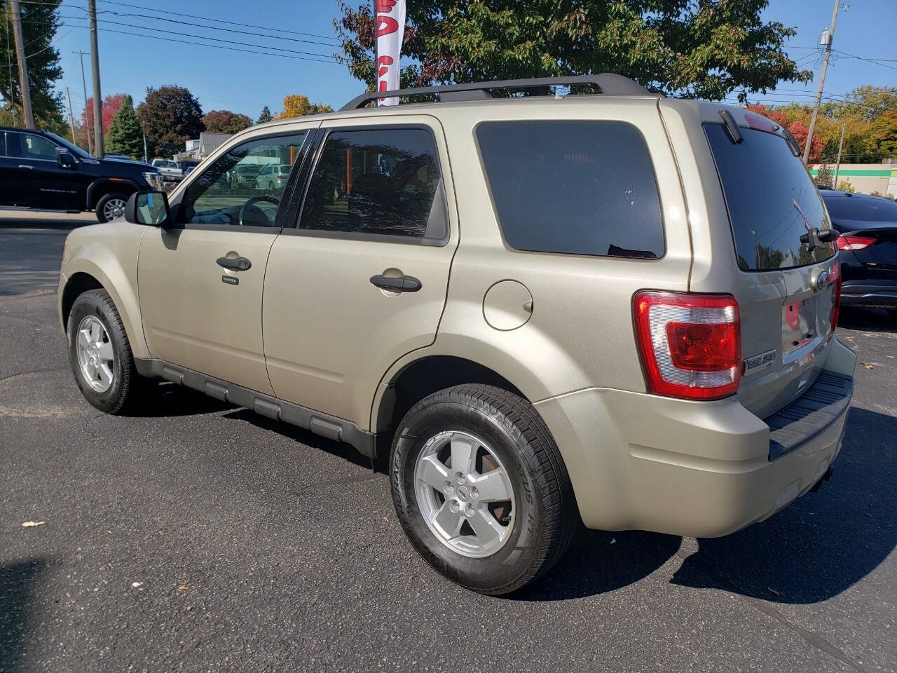 2011 Ford Escape for sale at Auto Shop in Wyoming, MI