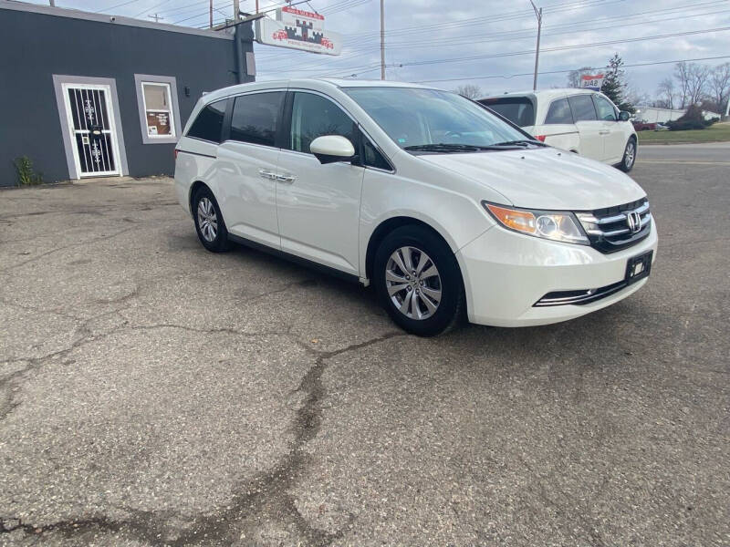 2015 Honda Odyssey for sale at Castle Cars Inc. in Lansing MI