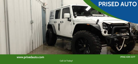 2015 Jeep Wrangler Unlimited for sale at PRISED AUTO in Gladstone MI