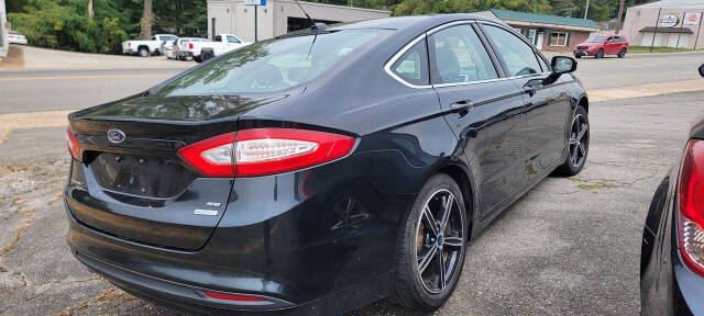 2014 Ford Fusion for sale at Cars For Less in Clarksville, TN