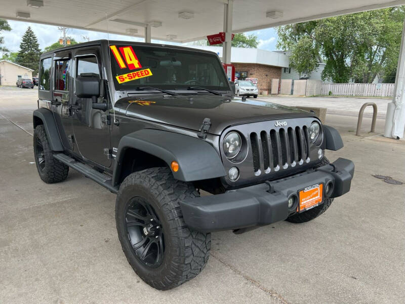 2014 Jeep Wrangler Unlimited for sale at REVOLUTION MOTORS LLC in Waukegan IL
