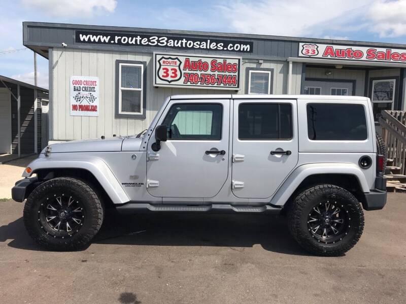 2011 Jeep Wrangler Unlimited for sale at Route 33 Auto Sales in Carroll OH