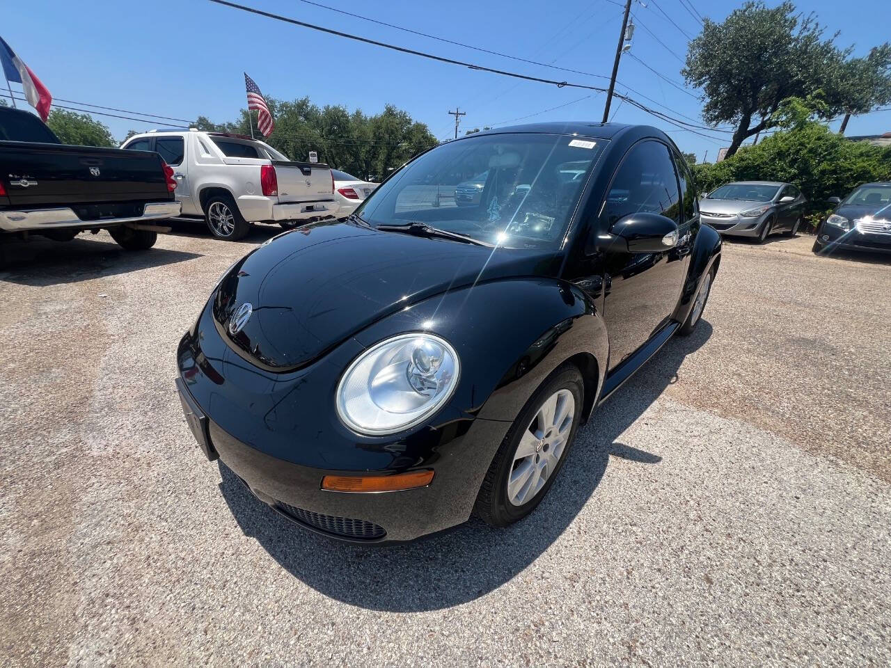 Black 2009 Volkswagen New Beetle Base 2dr Coupe 5M 4