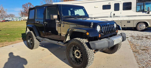 2013 Jeep Wrangler Unlimited for sale at CORNMAN AUTO LLC in Kirksville, MO