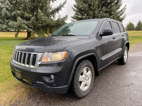 2011 Jeep Grand Cherokee for sale at BELOW BOOK AUTO SALES in Idaho Falls ID