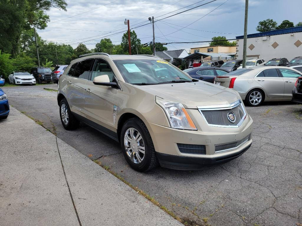 2011 Cadillac SRX for sale at DAGO'S AUTO SALES LLC in Dalton, GA