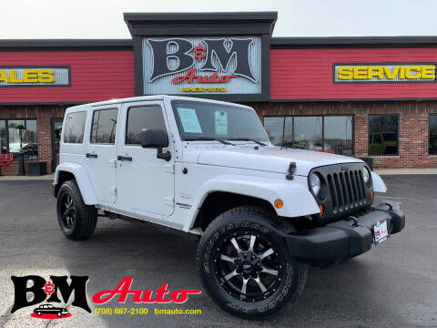 2012 Jeep Wrangler Unlimited for sale at B & M Auto Sales Inc. in Oak Forest IL