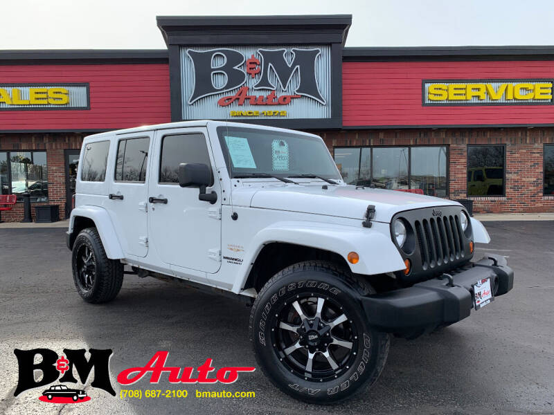 2012 Jeep Wrangler Unlimited for sale at B & M Auto Sales Inc. in Oak Forest IL